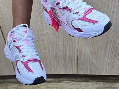 New Balance 530 sneakers in a white and pink sugar colorway
